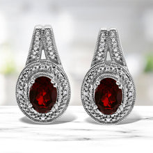 Load image into Gallery viewer, .925 Sterling Silver Diamond Accent and 8x6mm Red Oval Garnet Stud Earrings (I-J Color, I1-I2 Clarity)