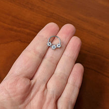 Load image into Gallery viewer, 16G 3/8 Clear Blue Gem Festive Trio Snowflake Hinged Segment Ring