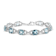 Load image into Gallery viewer, .925 Sterling Silver 7x7 mm Cushion Cut Blue Topaz and 1/20 cttw Round Cut Diamond Fashion Tennis Bracelet (I-J Color, I1-I2 Clarity) - 7"