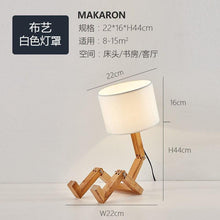 Load image into Gallery viewer, New Modern Luxury and Retro STEVVEX Wood Robot Shape Folding Table Lamp Creative European Fashion Bedroom Study Bedroom Bedside Linen Lamp Shade Table Lamp