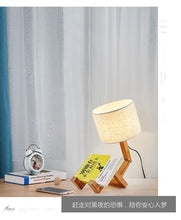 Load image into Gallery viewer, New Modern Luxury and Retro STEVVEX Wood Robot Shape Folding Table Lamp Creative European Fashion Bedroom Study Bedroom Bedside Linen Lamp Shade Table Lamp