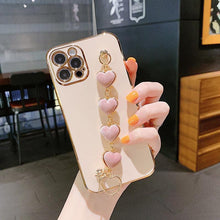 Load image into Gallery viewer, Luxury Women Silicone Phone Case Cover With Wrist Chain Bracelet for iPhone Wristband Bracelet Hand Holder Cover for iPhone 13 12 11 Pro Max plating Case Heart Chain Cases for iPhone 7 8 Plus XR XS Max X