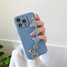 Load image into Gallery viewer, Soft Silicone Love Heart Chain Luxury Soft Flexible with Love Heart Chain Bracelet Hand Strap Girly Women Protective Cover for iPhone Wrist Bracelet Phone Case For iPhone 12 13 14 Pro Max Mini 11 Pro Max X XS Max XR 7 8 Plus