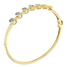 Load image into Gallery viewer, 14K Yellow Gold Alternating Bezel Set 5MM Oval Shaped Tanzanite and 1/5 Cttw Diamond Bangle Bracelet (H-I Color, VS2-SI1 Clarity) - Fit's wrists up to 7.25" Inches
