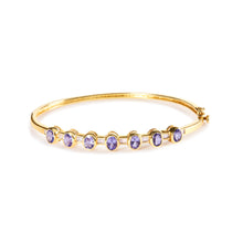 Load image into Gallery viewer, 14K Yellow Gold Alternating Bezel Set 5MM Oval Shaped Tanzanite and 1/5 Cttw Diamond Bangle Bracelet (H-I Color, VS2-SI1 Clarity) - Fit's wrists up to 7.25" Inches
