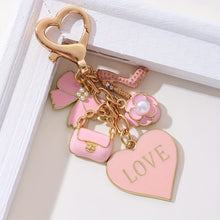 Load image into Gallery viewer, A Cute And Compact Pink Bag with a Heart-Shaped Oil Drop Keychain, Perfect As a Mini Decorative Accessory Or Gift for Cosmetics
