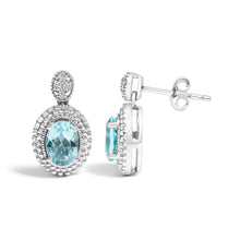 Load image into Gallery viewer, .925 Sterling Silver Diamond Accent and  Oval Blue Topaz with Beaded Halo Drop Stud Earrings (I-J color, I1-I2 Clarity)
