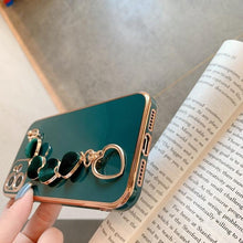 Load image into Gallery viewer, Luxury Women Silicone Phone Case Cover With Wrist Chain Bracelet for iPhone  Wristband Bracelet Hand Holder Cover for iPhone 13 12 11 Pro Max plating Case Heart Chain Cases for iPhone 7 8 Plus XR XS Max X
