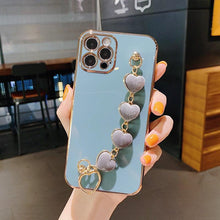 Load image into Gallery viewer, Luxury Women Silicone Phone Case Cover With Wrist Chain Bracelet for iPhone  Wristband Bracelet Hand Holder Cover for iPhone 13 12 11 Pro Max plating Case Heart Chain Cases for iPhone 7 8 Plus XR XS Max X
