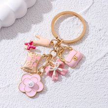 Load image into Gallery viewer, A Cute And Compact Pink Bag with a Heart-Shaped Oil Drop Keychain, Perfect As a Mini Decorative Accessory Or Gift for Cosmetics
