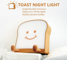Load image into Gallery viewer, LED Toast Night Light with Silicone Foot Phone Holder Table Lamp Infinite Dimming Bread Decoration Creative Lamp Decorative Table Lamp Cute Study Lamps for Bedroom Décor

